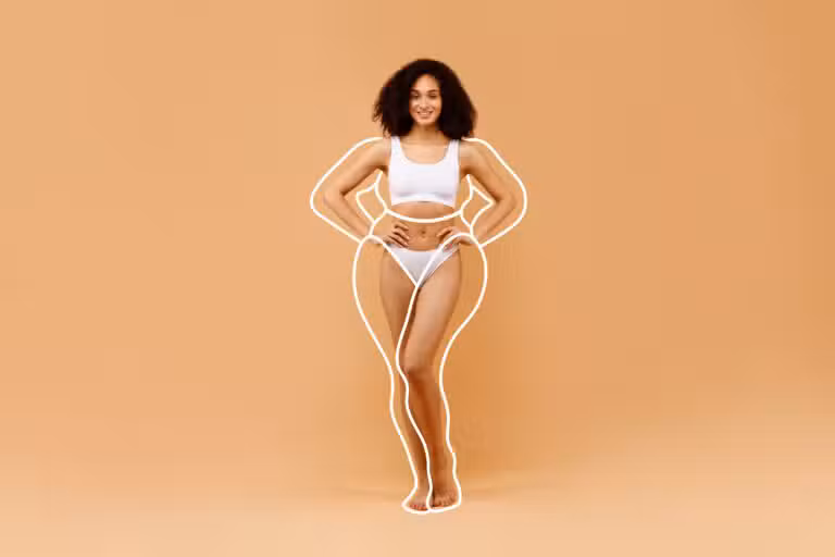 Slender woman in white underwear posing, highlighting the results of body contouring procedures like arm lift and tummy tuck for enhanced curves and toned appearance